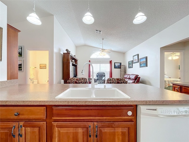 kitchen featuring ceiling fan, sink, white dishwasher, a textured ceiling, and vaulted ceiling