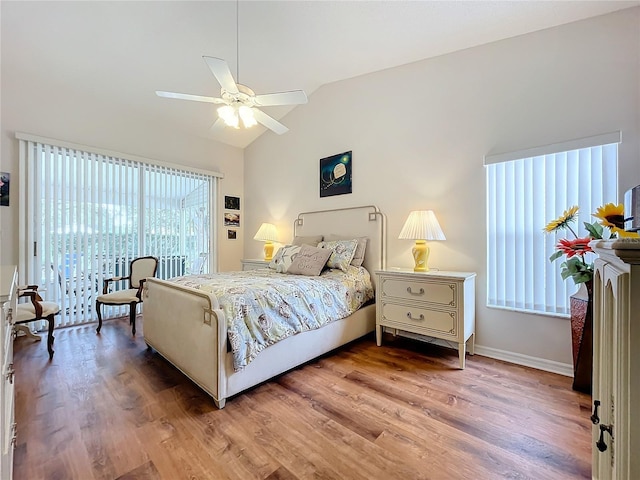 bedroom featuring ceiling fan, wood-type flooring, and lofted ceiling