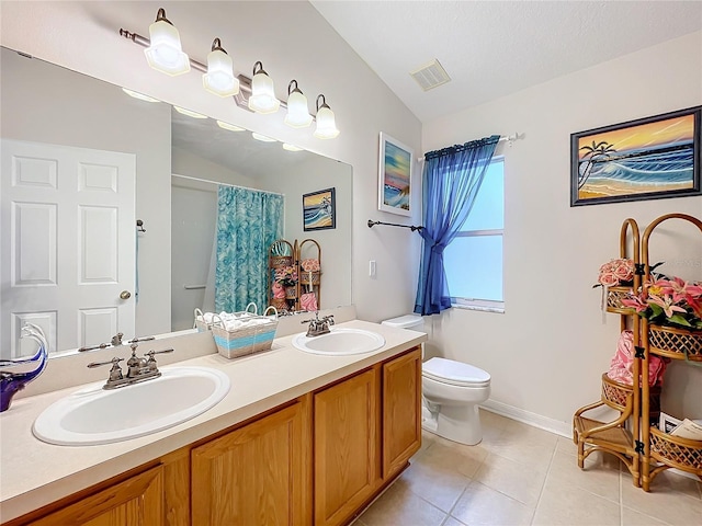 bathroom featuring vanity, vaulted ceiling, tile patterned flooring, toilet, and curtained shower