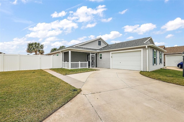 view of front of house with a garage, a front lawn, and covered porch