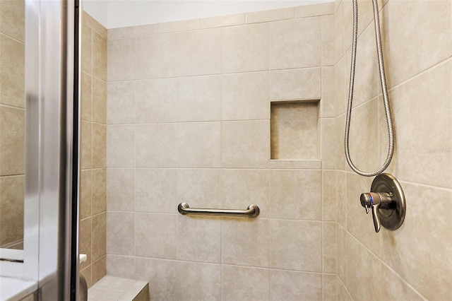 bathroom with tiled shower