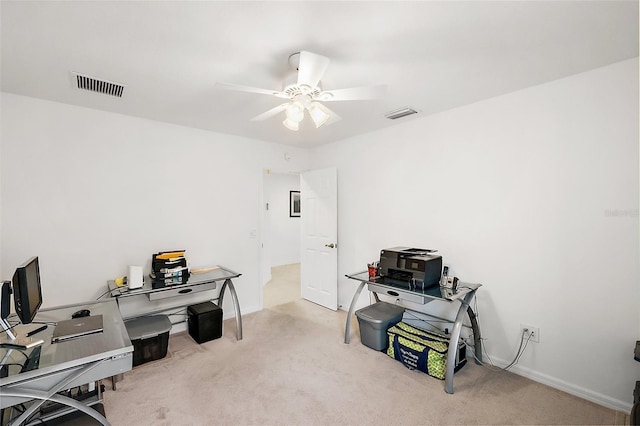 carpeted office with ceiling fan