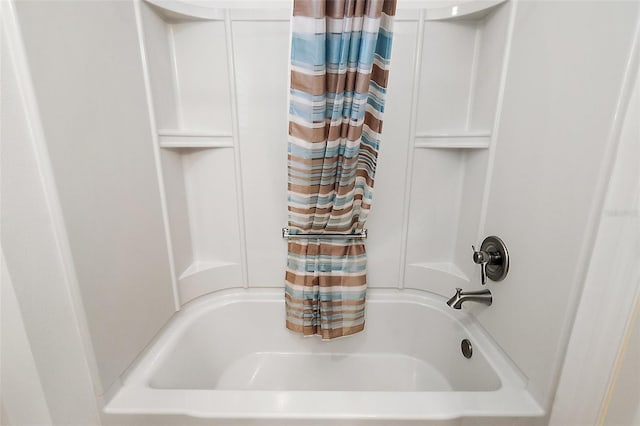 bathroom featuring shower / bathtub combination with curtain