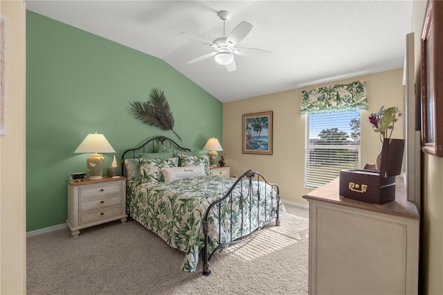 carpeted bedroom with ceiling fan and lofted ceiling