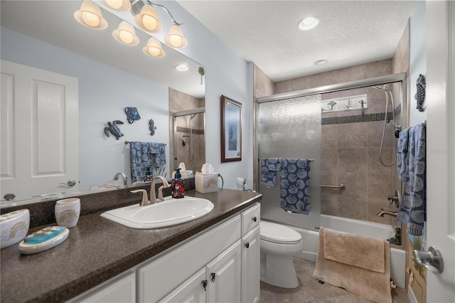 full bathroom with enclosed tub / shower combo, tile patterned floors, a textured ceiling, toilet, and vanity