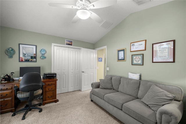 office space featuring light carpet, vaulted ceiling, and ceiling fan