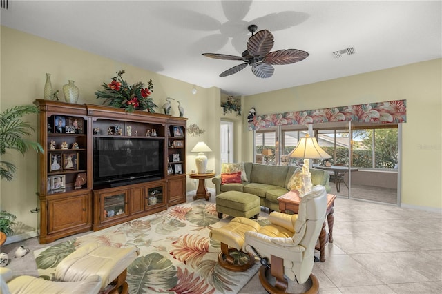 living room featuring ceiling fan and light tile patterned floors