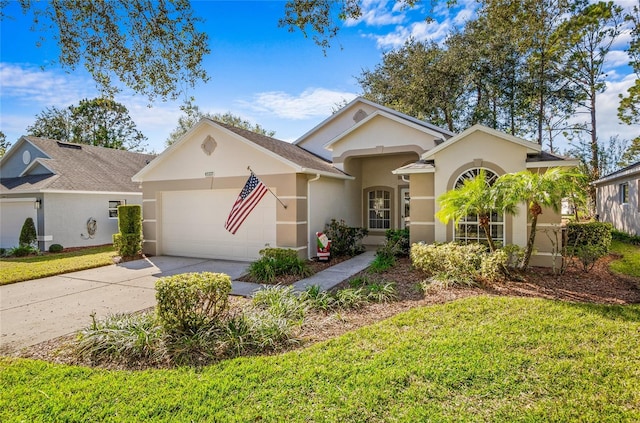 view of front of house with a front lawn and a garage