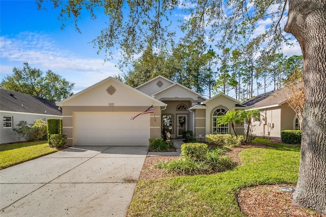 ranch-style home with a garage and a front yard