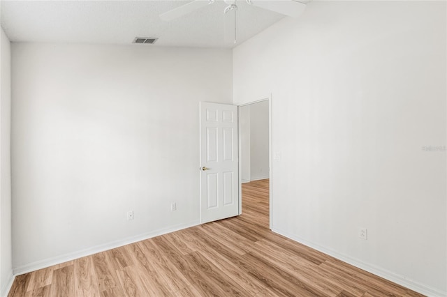 empty room with light hardwood / wood-style flooring and ceiling fan