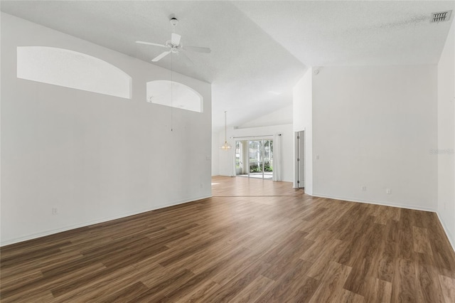 unfurnished living room featuring ceiling fan, dark hardwood / wood-style floors, and a textured ceiling