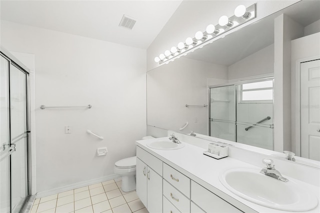 bathroom featuring toilet, a shower with shower door, vaulted ceiling, vanity, and tile patterned flooring