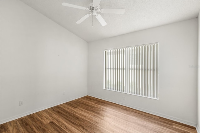 unfurnished room with a textured ceiling, ceiling fan, and light hardwood / wood-style flooring