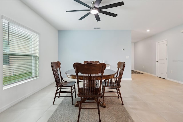 dining area featuring ceiling fan, a healthy amount of sunlight, and light tile patterned flooring