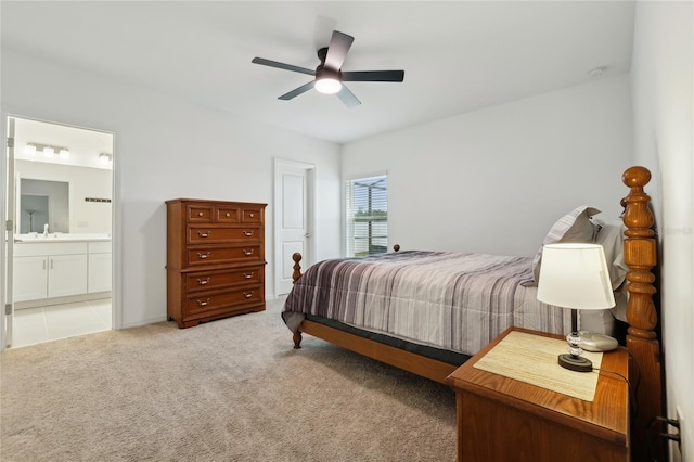 carpeted bedroom featuring ceiling fan, sink, and connected bathroom