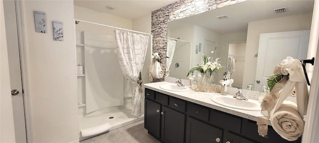 bathroom featuring a shower with shower curtain, vanity, and tile patterned floors