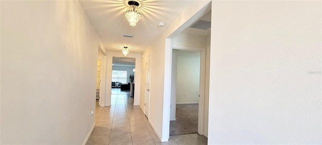 hallway featuring light tile patterned floors