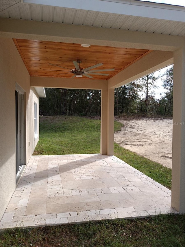 view of patio featuring ceiling fan