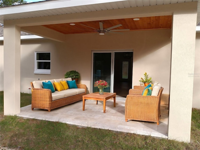 view of patio with ceiling fan and an outdoor living space