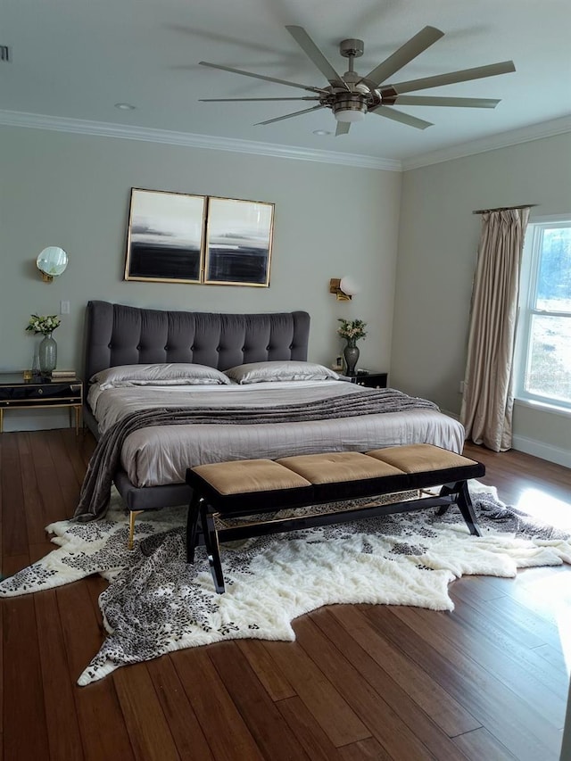 bedroom with ceiling fan, hardwood / wood-style flooring, and crown molding