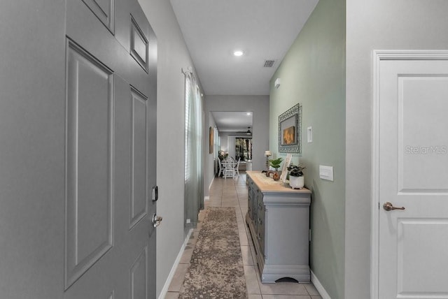 hallway with light tile patterned floors