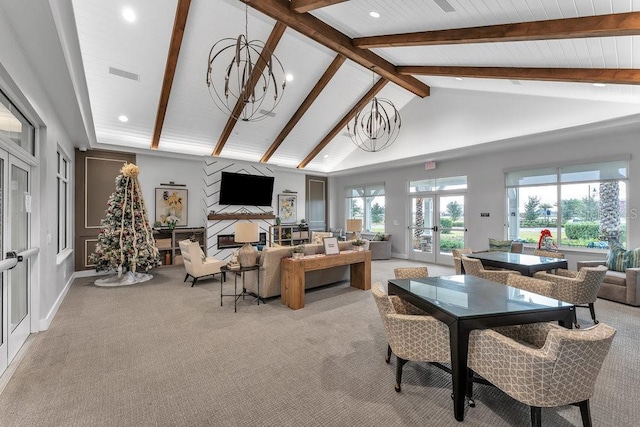 living room with french doors, high vaulted ceiling, beamed ceiling, a chandelier, and light carpet