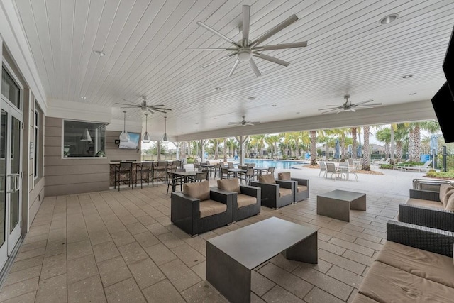 view of patio / terrace with an outdoor hangout area and a bar