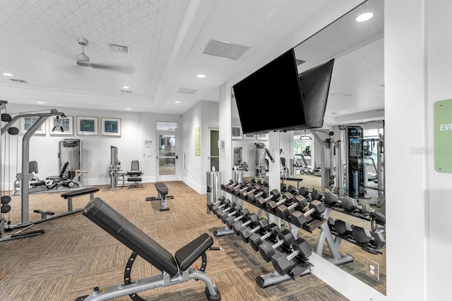 gym featuring carpet and ceiling fan