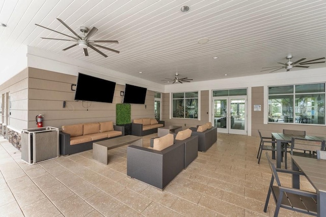 view of patio with an outdoor living space and french doors