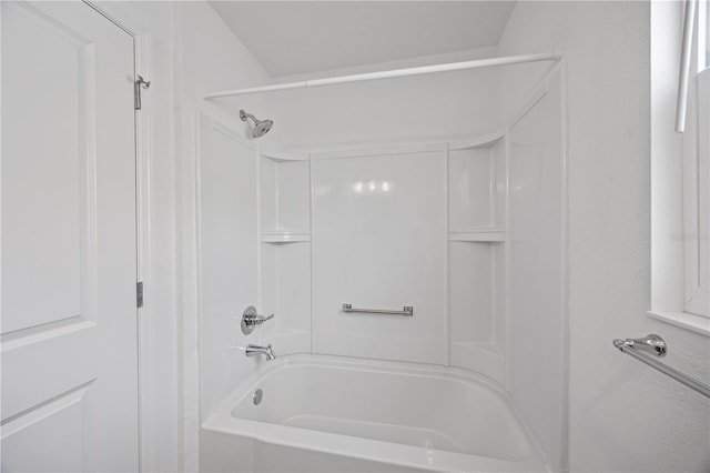 bathroom with shower / washtub combination