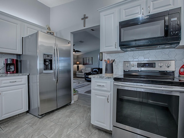 kitchen with white cabinetry, appliances with stainless steel finishes, and decorative backsplash