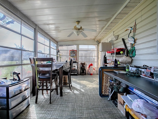 sunroom / solarium featuring wood ceiling and ceiling fan