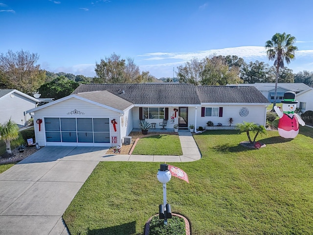 ranch-style house featuring a garage, a porch, and a front lawn