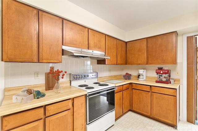 kitchen with decorative backsplash and white electric range