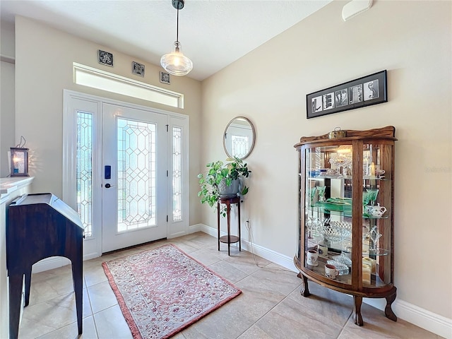 tiled foyer with a wealth of natural light