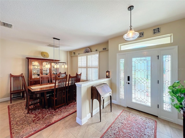 foyer featuring light tile patterned flooring