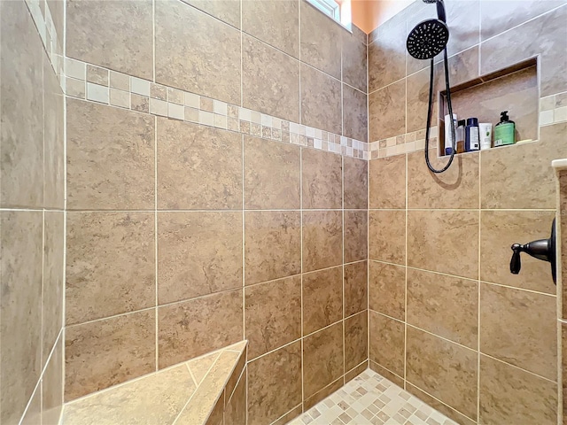 bathroom featuring tiled shower