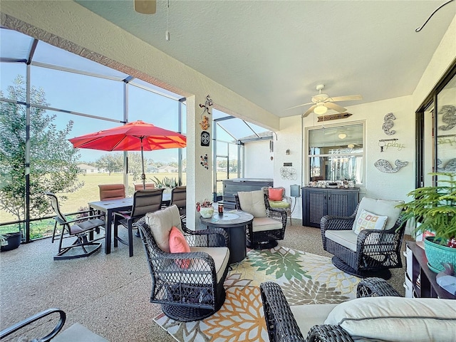 view of patio / terrace featuring an outdoor hangout area, a hot tub, ceiling fan, and a lanai