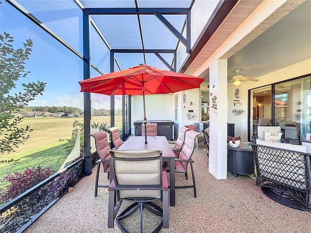 sunroom / solarium featuring ceiling fan