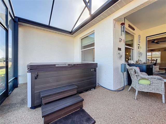 exterior space featuring a hot tub