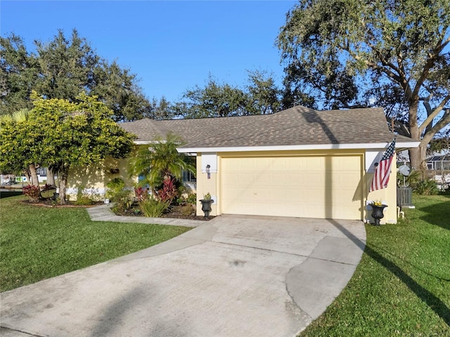 single story home featuring a front lawn and a garage