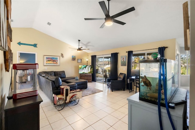 tiled living room featuring ceiling fan and vaulted ceiling