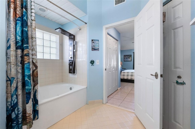 bathroom with tile patterned flooring and shower / tub combo with curtain