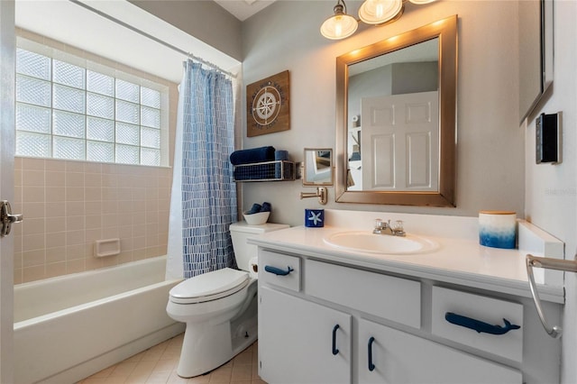 full bathroom with tile patterned flooring, vanity, toilet, and shower / bath combo with shower curtain