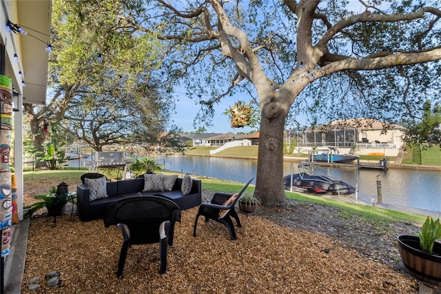 view of yard with an outdoor living space and a water view