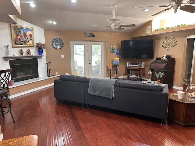 living room featuring french doors, dark wood-type flooring, and vaulted ceiling