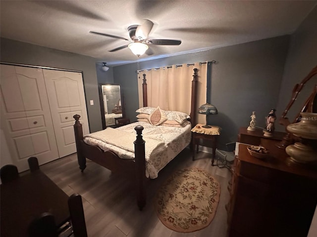 bedroom with ceiling fan, a closet, and hardwood / wood-style flooring