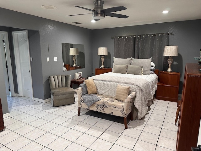 tiled bedroom featuring ceiling fan