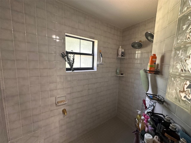 bathroom with a tile shower