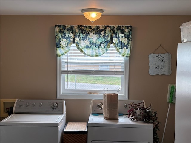 laundry room with independent washer and dryer